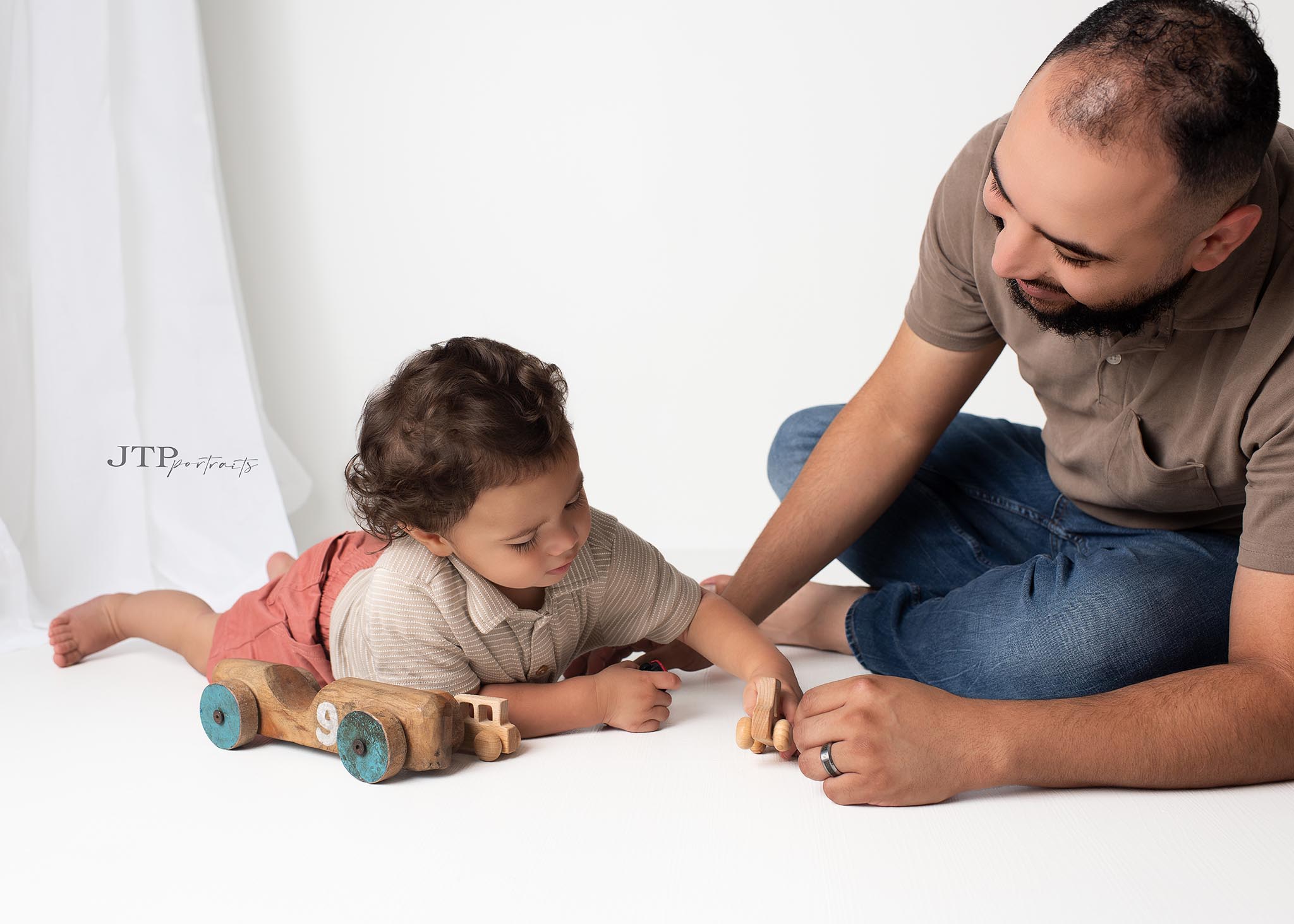 Daddy & Me Strong Hands, Soft Hearts. Capture the special bond between father and child in portraits that will make your heart melt.